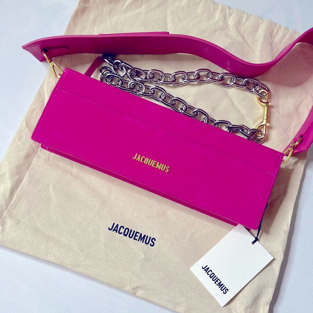 Structured suede shoulder bag in pink. Detachable leather shoulder strap.